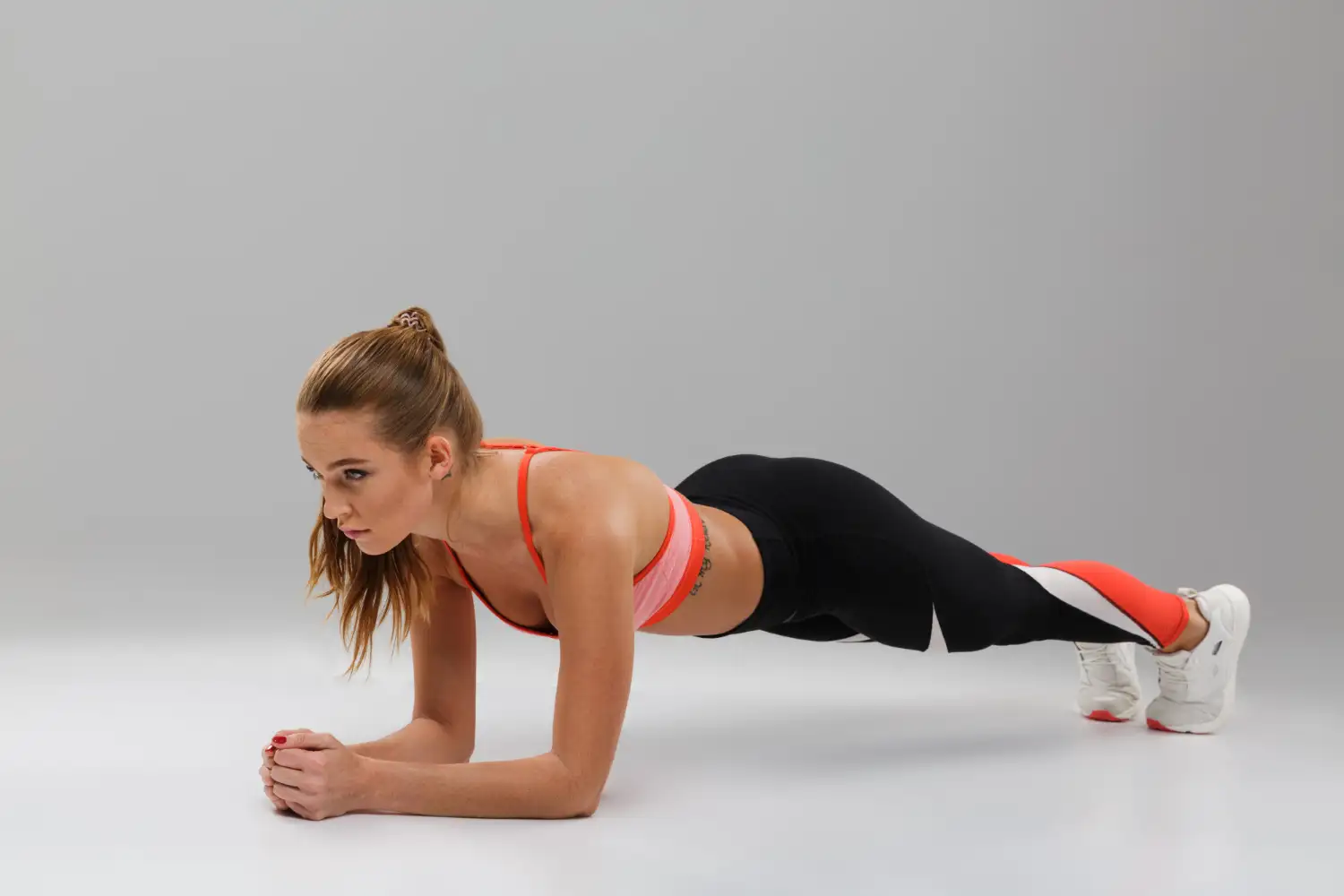 A image of a woman in a plank position